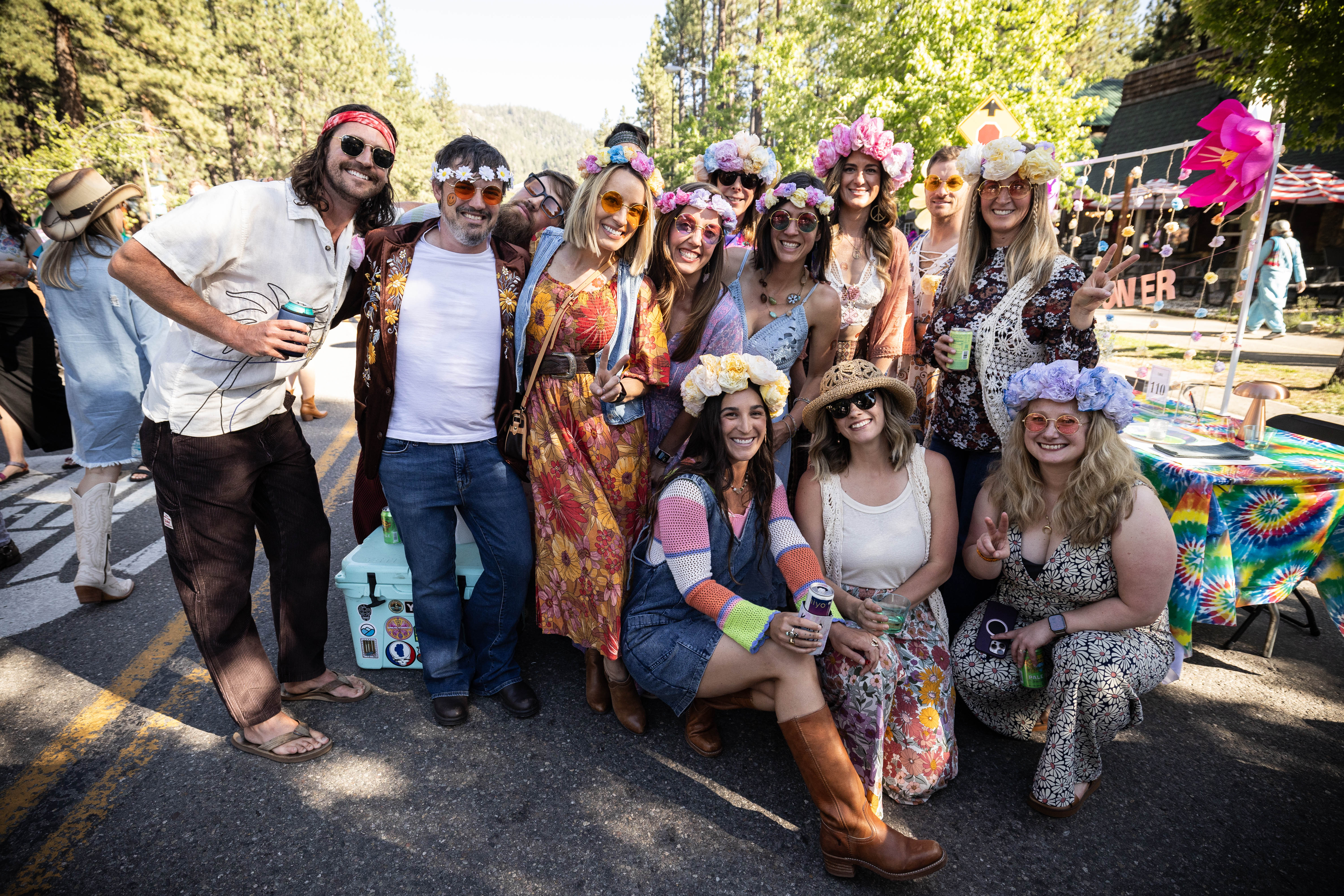 Guests in hippie costumes celebrating at their themed table