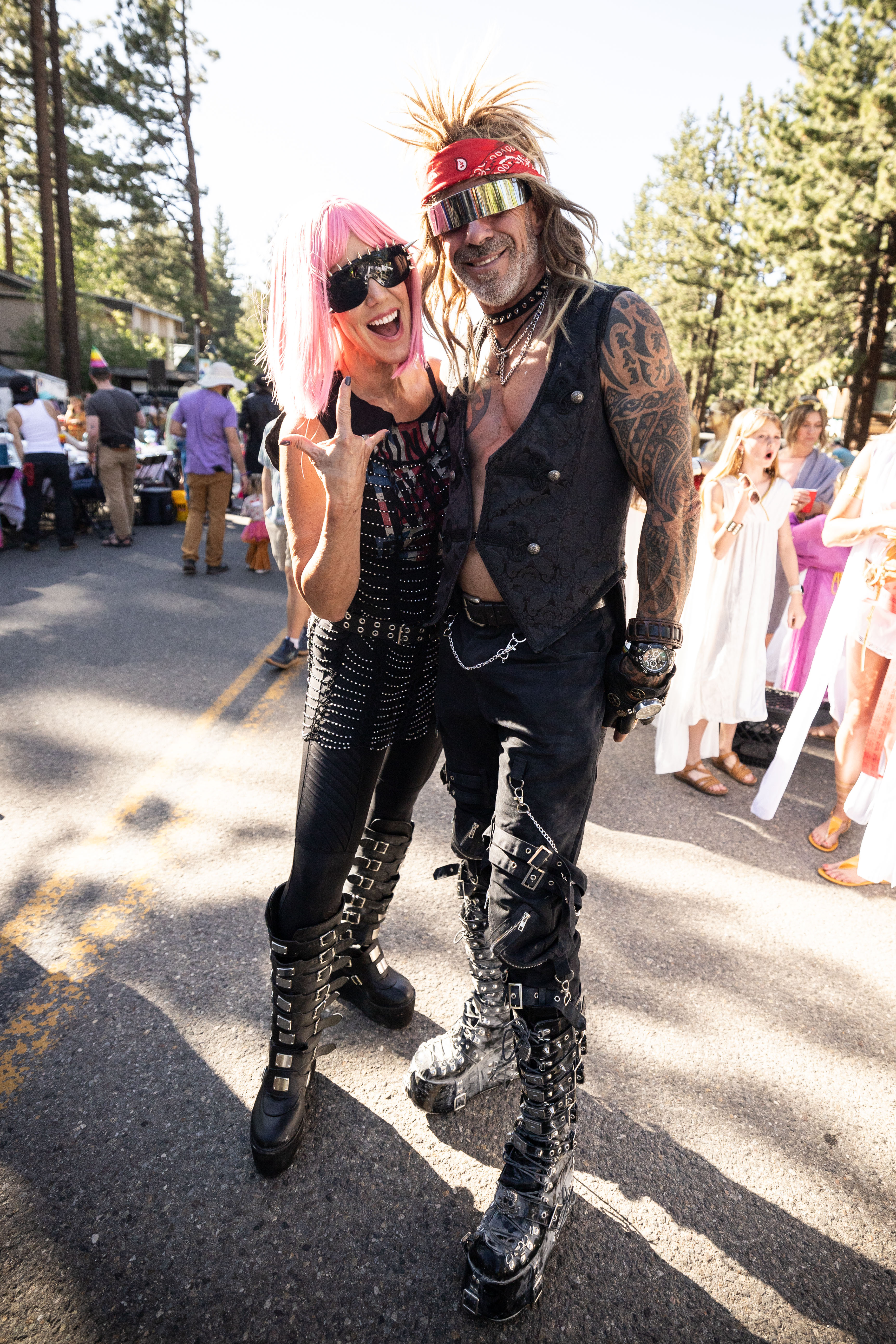 Rock-themed couple posing at their decorated table