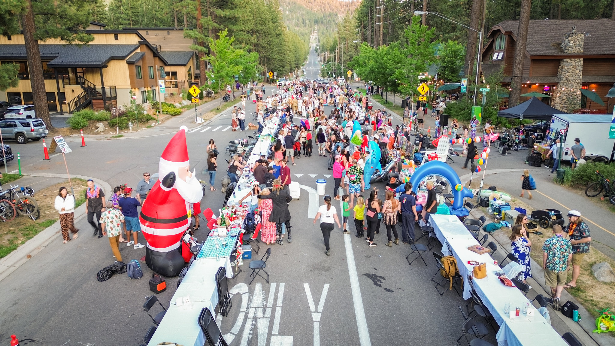 Aerial view of The Longest Dinner Table stretching through South Lake Tahoe at dusk